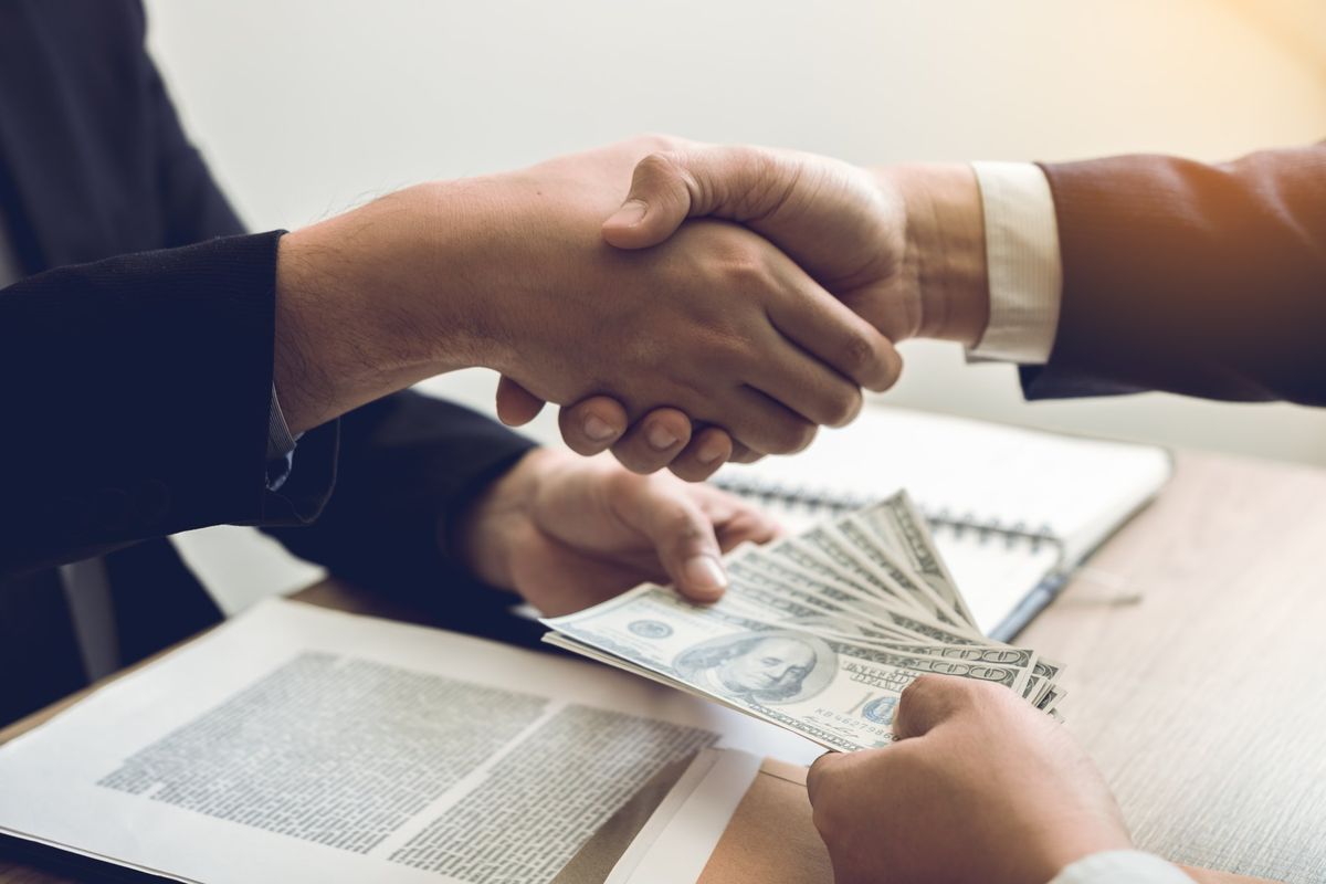 Financial advisors meeting with clients